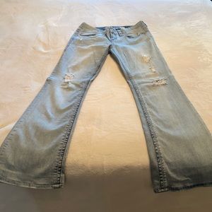Size 28- boot cut, light blue, 7 jeans.